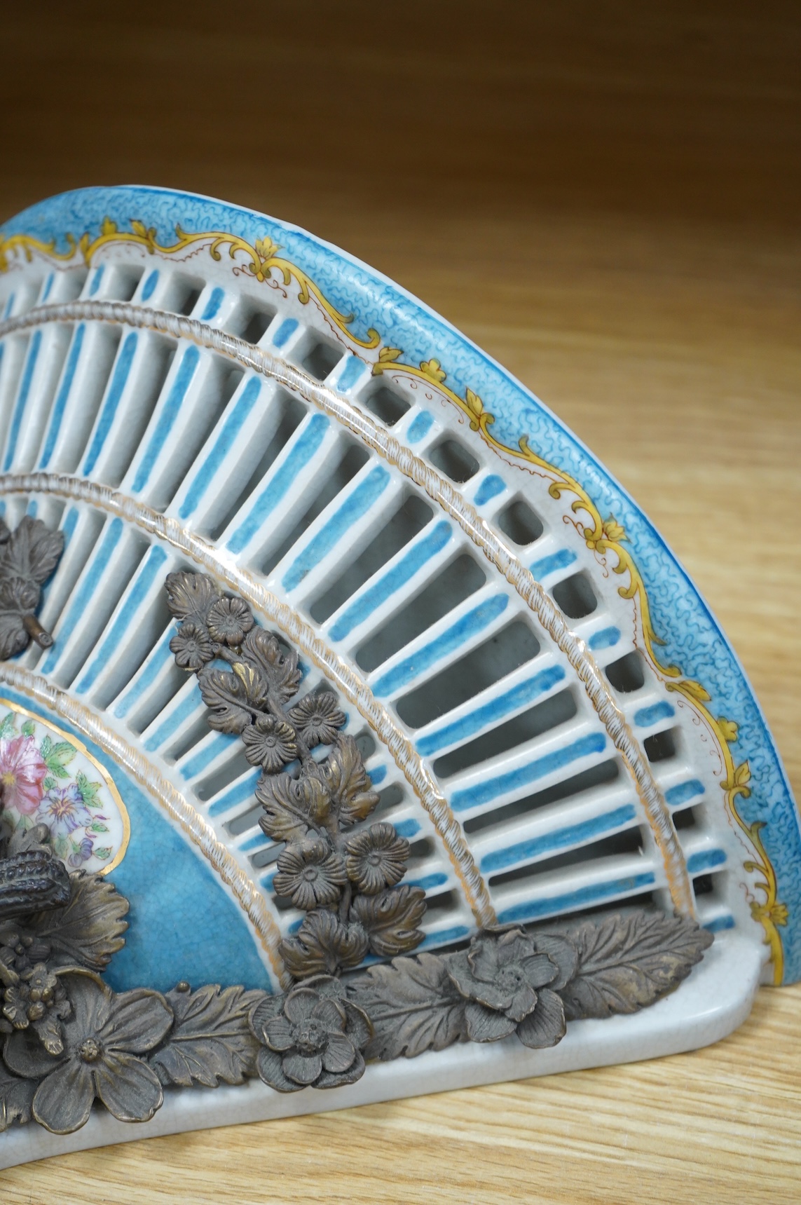 A pair of Sevres style pierced ceramic brackets with bronze mounts, 26 x 31cm